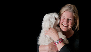 happy woman holding dog named Powder